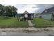 Enclosed backyard with a small shed, patio furniture, and a well-maintained lawn at 2021 Columbia Ave, Indianapolis, IN 46202