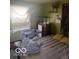 Image of bedroom with tan bed, grey bassinet, and wooden dresser at 2021 Columbia Ave, Indianapolis, IN 46202