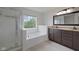 This bathroom features double sinks, a large mirror, and a separate shower and tub at 2078 Seneca Ln, Plainfield, IN 46168