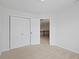 This bedroom features plush carpet, a closet, and neutral walls at 2078 Seneca Ln, Plainfield, IN 46168