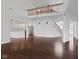 Open floor plan connecting the living room, kitchen, and staircase with hardwood floors at 2078 Seneca Ln, Plainfield, IN 46168