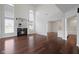 Open-concept living room with high ceilings, a fireplace, and hardwood floors at 2078 Seneca Ln, Plainfield, IN 46168