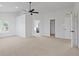 Bright main bedroom features plush carpeting, neutral walls, a ceiling fan, and ensuite bathroom at 2078 Seneca Ln, Plainfield, IN 46168