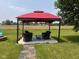 Enjoy outdoor living with a gazebo, patio furniture, and peaceful backyard views at 2213 Holden Dr, Anderson, IN 46012