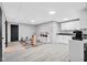 Finished basement with play area, kitchenette, durable vinyl flooring, and ample lighting at 2384 Fairfax Dr, Columbus, IN 47203