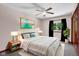 Bright bedroom with a ceiling fan, a large window and simple décor at 2384 Fairfax Dr, Columbus, IN 47203