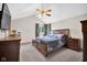 Bedroom featuring a large bed, dresser, and a window with natural light at 2384 Fairfax Dr, Columbus, IN 47203