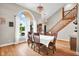 Elegant dining room with large windows, natural light, and beautiful hardwood floors at 2384 Fairfax Dr, Columbus, IN 47203