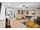 Inviting living room with wood floors, a comfortable sofa, and a ceiling fan for added comfort at 2384 Fairfax Dr, Columbus, IN 47203