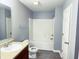 Bright bathroom featuring a vanity, toilet, and shower-tub combo at 3314 Montgomery Dr, Indianapolis, IN 46227
