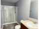 Well-lit bathroom featuring a glass shower stall and vanity with sink at 3314 Montgomery Dr, Indianapolis, IN 46227