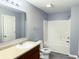 Bright bathroom featuring a vanity, toilet, and shower-tub combo at 3314 Montgomery Dr, Indianapolis, IN 46227
