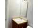 Bathroom featuring a white sink with a vanity, mirror, and a neutral color scheme at 3314 Montgomery Dr, Indianapolis, IN 46227
