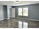 Light-filled bedroom with wood floors and a window that offers ample natural light at 3314 Montgomery Dr, Indianapolis, IN 46227
