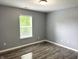 Cozy bedroom with natural light and wood floors at 3314 Montgomery Dr, Indianapolis, IN 46227