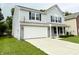 Side angle of home with two car garage, showing a well maintained lawn at 3314 Montgomery Dr, Indianapolis, IN 46227