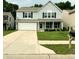 Two-story home with a two car garage, brick and siding accents, and a well maintained lawn at 3314 Montgomery Dr, Indianapolis, IN 46227