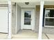Close-up of a front door with glass panel, white trim, and dark hardware at 3314 Montgomery Dr, Indianapolis, IN 46227