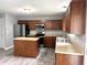 The kitchen features stainless steel appliances, a kitchen island, and light countertops at 3314 Montgomery Dr, Indianapolis, IN 46227