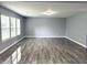 Bright living room features modern wood flooring, gray walls, and a large window at 3314 Montgomery Dr, Indianapolis, IN 46227