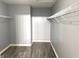 Spacious walk-in closet with wooden floors and wire shelving for organized storage at 3314 Montgomery Dr, Indianapolis, IN 46227