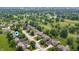 Overhead shot of residential neighborhood near a golf course; featuring manicured lawns and mature trees at 3545 Inverness Blvd, Carmel, IN 46032