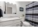 Clean bathroom featuring a vanity with a white countertop, a single sink, and a shower with a black and white curtain at 3545 Inverness Blvd, Carmel, IN 46032