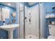 Clean bathroom featuring a stall shower with clear glass door, sink, and toilet at 3545 Inverness Blvd, Carmel, IN 46032