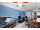 Comfortable bonus room featuring bright blue walls, carpeting, ceiling fan, and relaxing seating at 3545 Inverness Blvd, Carmel, IN 46032