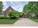Charming brick home with well-maintained landscaping and a welcoming driveway at 3545 Inverness Blvd, Carmel, IN 46032