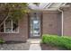 Inviting front entrance with brick facade, house number, and landscaped bushes at 3545 Inverness Blvd, Carmel, IN 46032