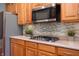 Modern kitchen with stainless steel appliances, gas cooktop, and decorative backsplash at 3545 Inverness Blvd, Carmel, IN 46032