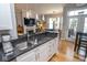 Stylish kitchen with granite counters, stainless steel sink, and hardwood floors at 355 E Ohio St # 211, Indianapolis, IN 46204