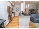 Bright kitchen with stainless steel fridge, granite counters, and hardwood floors at 355 E Ohio St # 211, Indianapolis, IN 46204