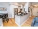 Charming kitchen with granite countertops, island seating, and stainless steel appliances at 355 E Ohio St # 211, Indianapolis, IN 46204