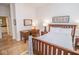 Serene bedroom featuring a wooden bed frame, desk, and side tables, providing a comfortable and functional space at 355 E Ohio St # 211, Indianapolis, IN 46204
