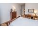 Bright bedroom with a wooden bed, desk, and ample storage, ideal for rest and relaxation at 355 E Ohio St # 211, Indianapolis, IN 46204