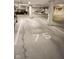 Well-maintained parking garage, with visible parking space number 75 at 355 E Ohio St # 211, Indianapolis, IN 46204