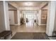 Expansive hallway with tile floors, architectural columns, and access to other community spaces at 355 E Ohio St # 211, Indianapolis, IN 46204