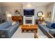 A bright living room with hardwood floors, a fireplace, and stylish decor creates a warm atmosphere at 355 E Ohio St # 211, Indianapolis, IN 46204