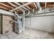 Unfinished basement featuring exposed brick, concrete floor and industrial-style HVAC system at 4010 S Bazil Ave, Indianapolis, IN 46239