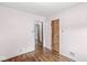 Hardwood floors enhance this bedroom that also has a view into an adjacent room at 4010 S Bazil Ave, Indianapolis, IN 46239