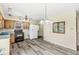 Cozy kitchen features hardwood-style flooring, ample cabinet space, and modern appliances at 4010 S Bazil Ave, Indianapolis, IN 46239