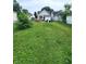 Fenced backyard featuring grass and home exterior at 408 W 4Th St, Anderson, IN 46016