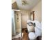 Bathroom featuring tile, a shower stall, and a white vanity with a granite top at 408 W 4Th St, Anderson, IN 46016