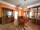 Dining room featuring orange walls, wood flooring, and a chandelier at 408 W 4Th St, Anderson, IN 46016