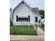 Charming white single Gathering home with a well-maintained lawn and an inviting front entrance at 408 W 4Th St, Anderson, IN 46016