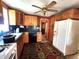 Functional kitchen with gas range, dishwasher, wooden cabinetry, and dark green backsplash at 408 W 4Th St, Anderson, IN 46016
