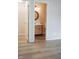 Bathroom with wooden vanity, round mirror, and ceramic tile flooring at 4114 Dunedin Ct, Noblesville, IN 46062