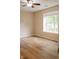 Cozy bedroom with wood flooring, window, and ceiling fan providing a comfortable atmosphere at 4114 Dunedin Ct, Noblesville, IN 46062